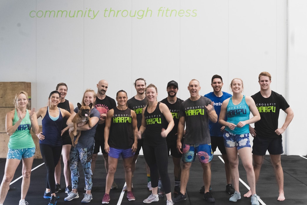 High-spirited group at CrossFit Haapu, Nerang, Gold Coast, posing together, exemplifying teamwork and community.